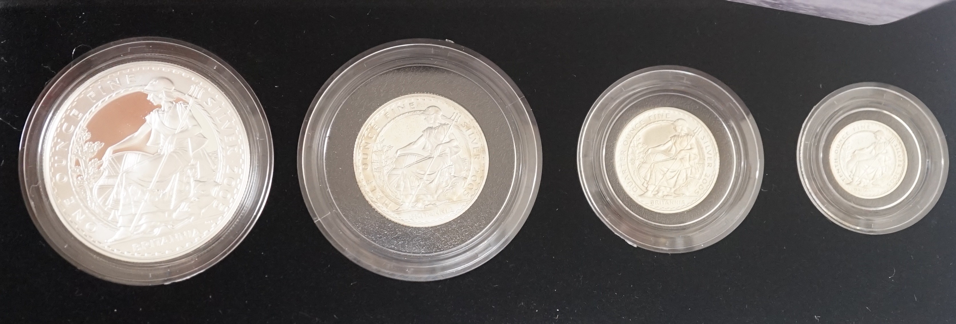 Two cased Royal Mint Britannia silver proof four coin sets, 2005 and 2008, 20p to £2